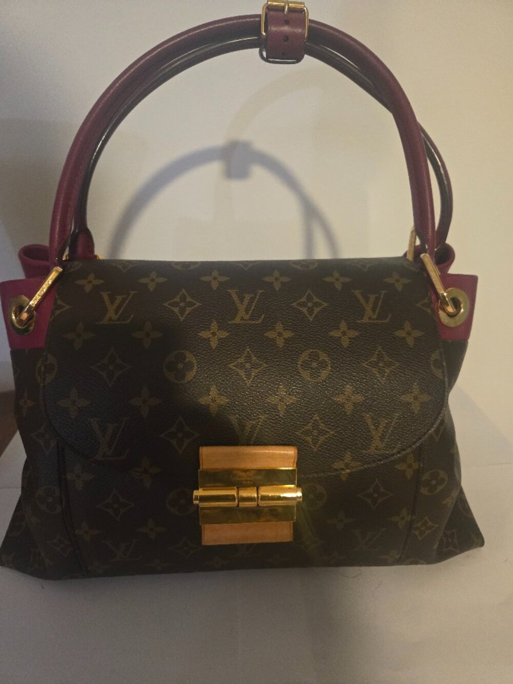 Louis Vuitton Olympe Monogram canvas, burgundy leather & brass hardware bag